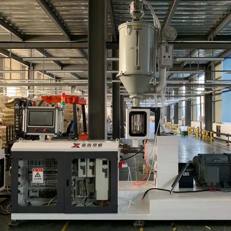 what is plastic extruder machine? Jinxin plastic extruder machine line producing PC profiles in a factory