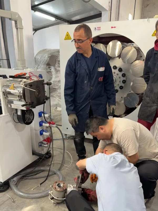 Jason and the engineers are helping a customer disassemble and clean a mold